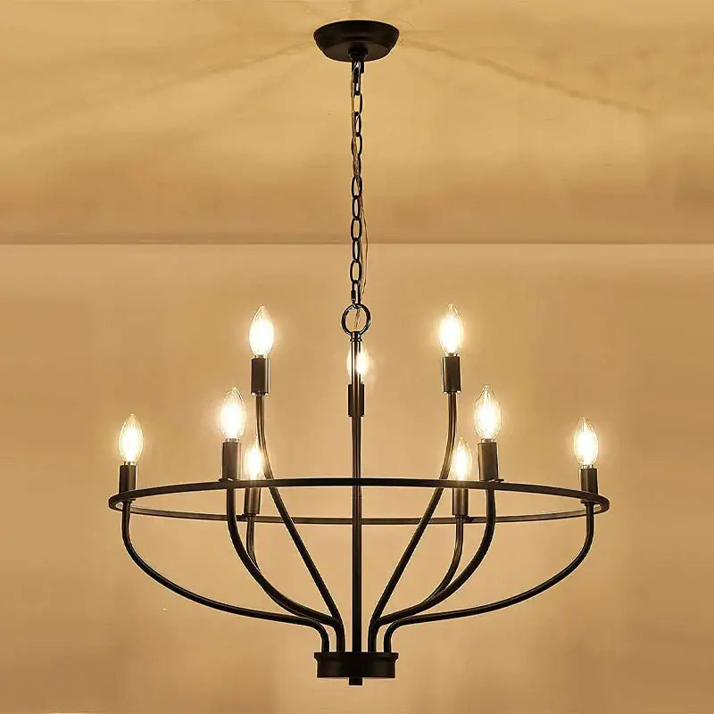 Black wrought iron art retro chandelier with six lit candle-style bulbs for american farmhouse dining room decorbites iron art