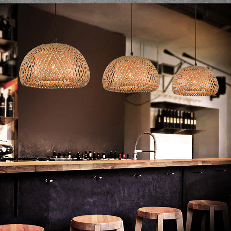 Rattan pendant light with woven texture, natural brown color.