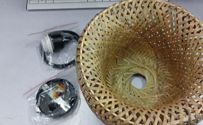 Bamboo woven basket with natural tan and brown tones, handcrafted design.