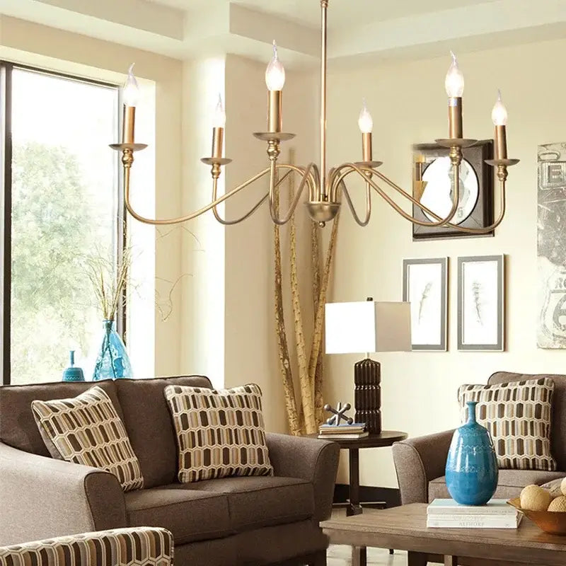 Antique brass american iron chandelier light with five candle-style bulbs and ornate curved arms for living room decorbites american iron
