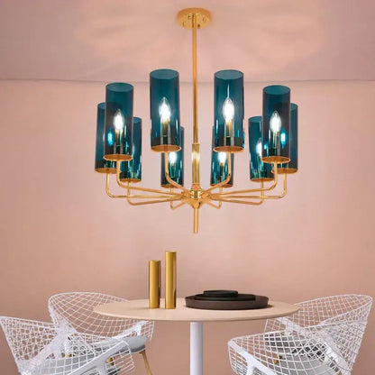 A modern decorbites american lustre glass chandelier with gold metal frame and teal glass cylinders for dining room lighting