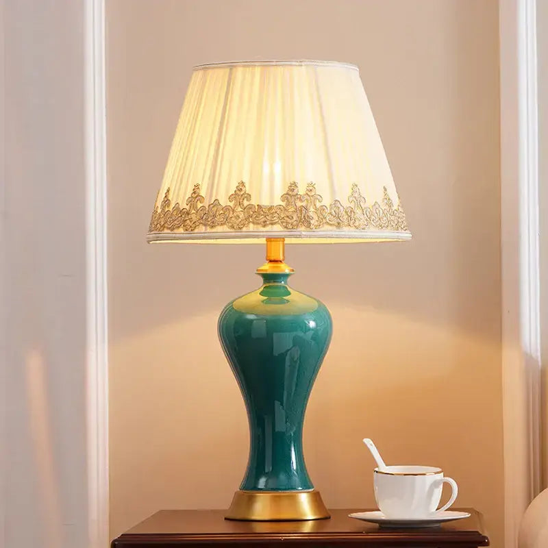 Elegant teal american luxury ceramic table lamp with gold accents and cream pleated shade for bedroom decorbites american luxury