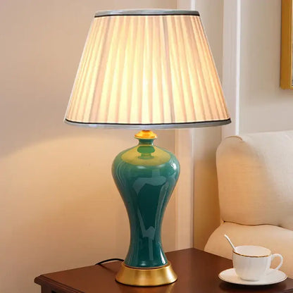 Teal american luxury ceramic table lamp with pleated beige shade and gold accents for elegant bedroom decorbites American luxury