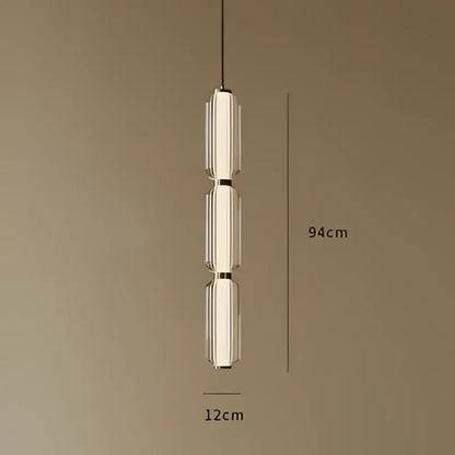 A modern american retro frosted glass staircase pendant light with three stacked cylindrical shades and metallic frame