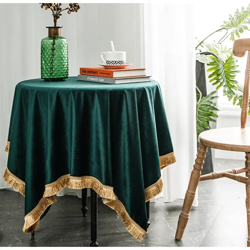 Emerald green velvet table cloth with gold fringe trim for elegant decorbites gold velvet wedding and dining room decor