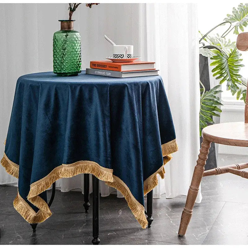 Deep blue velvet table cloth with gold fringe trim decorbites gold velvet wedding and dining room decor