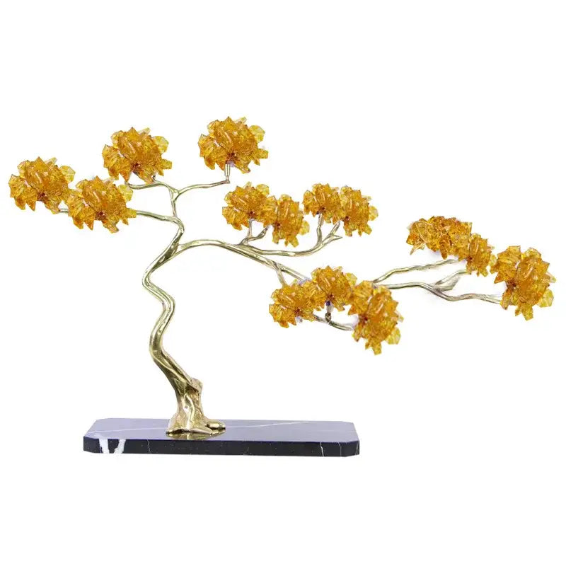 Golden amber glass bonsai tree decorative figurine with sleek brass metal trunk on polished black marble base for decor