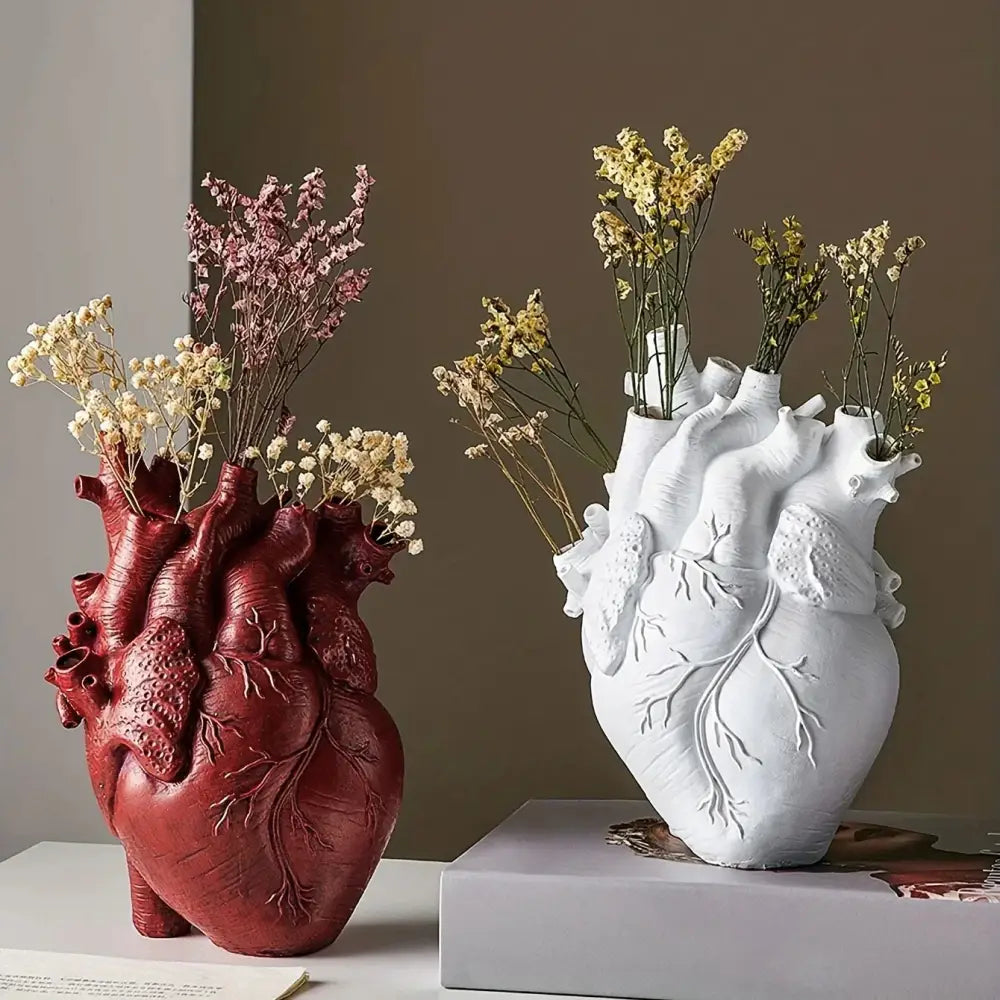Red and white anatomical heart resin vases holding dried flowers for glam decor in the decorbites anatomical heart vase collection