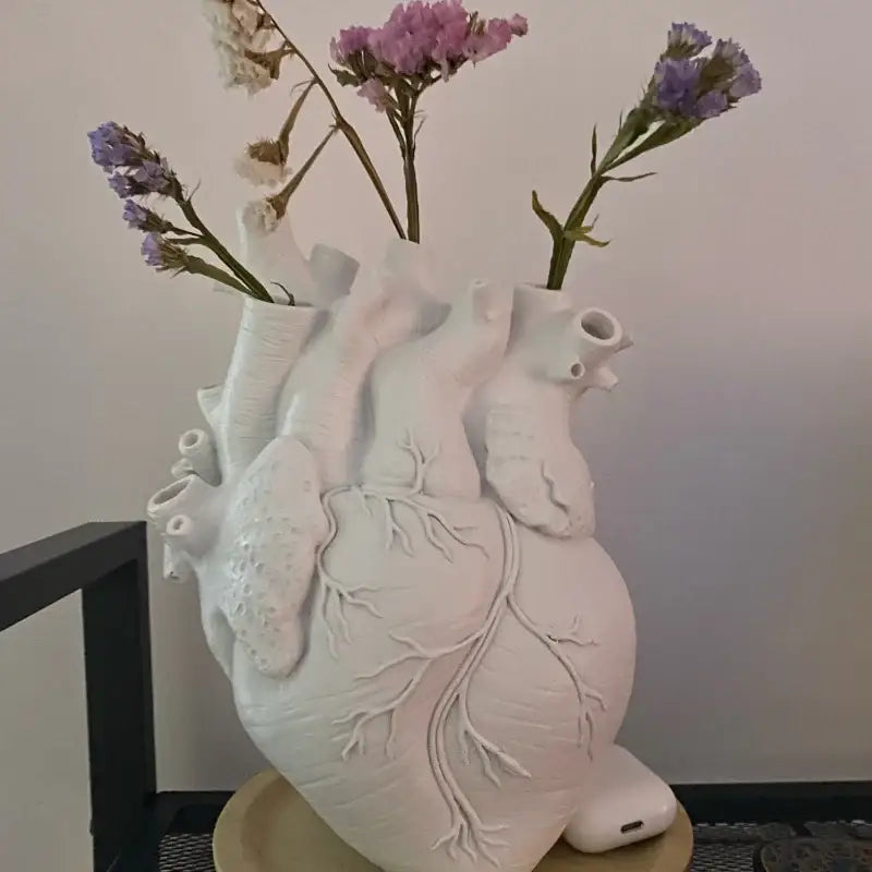 Anatomical white ceramic heart shape vase with detailed features ideal for living room decor and decorbites heart shape collections