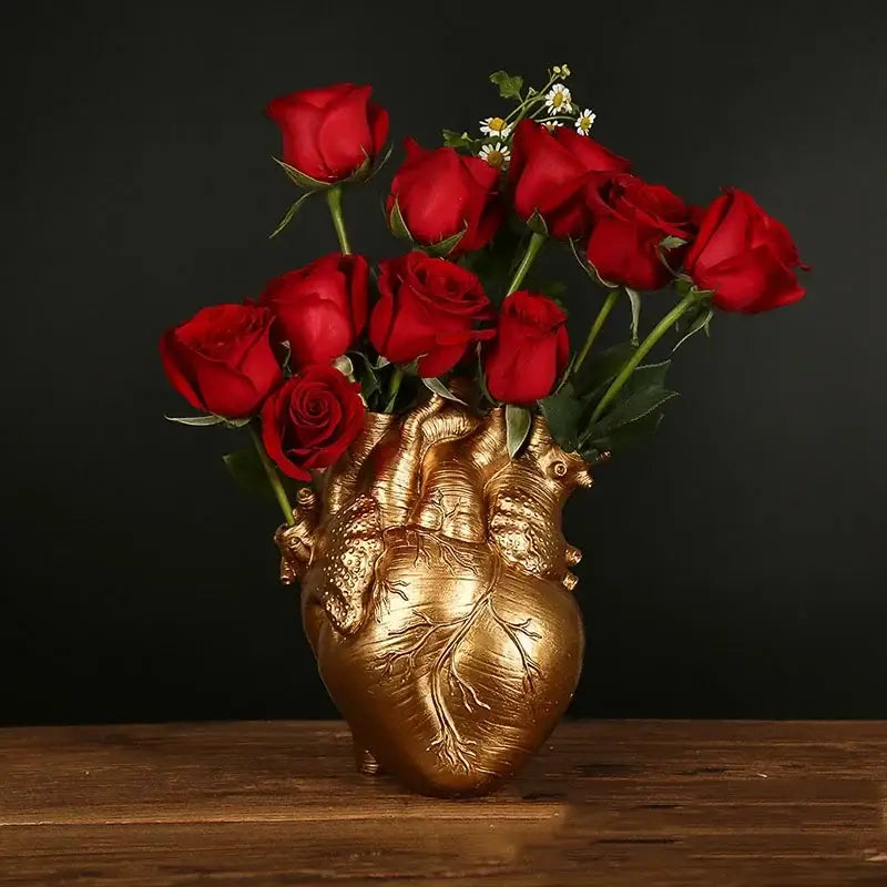 Golden anatomy heart vase holding a bouquet of vibrant red roses perfect as a valentine gift heart vase dry pot