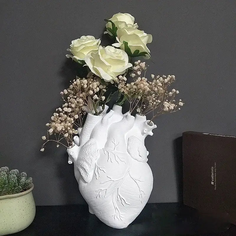 White anatomical heart vase with embossed veins holding cream roses and babys breath by DecorBites™ ideal dry pot gift