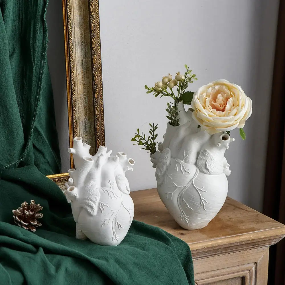 White ceramic anatomy heart vase with detailed features and decorative branches by DecorBites™ for unique gifts