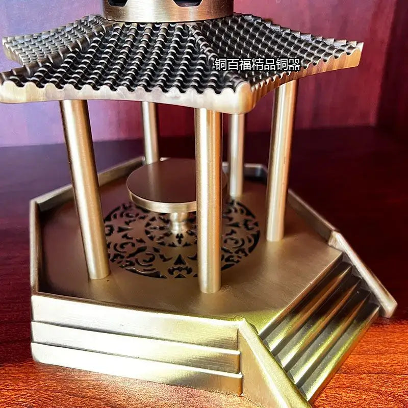 Brass incense burner shaped like an ancient pavilion with intricate roof tiles and ornate base for living room decor