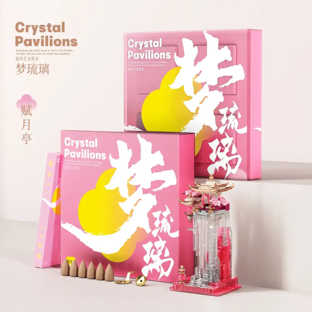 A delicate glass fu yue pavilion ornament with golden roof and pink floral accents on red base for living room decor