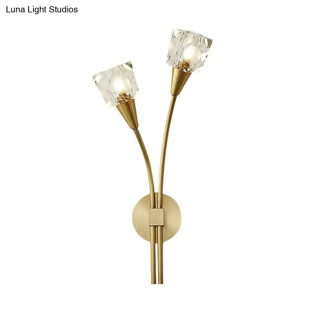 Gold-toned e12 wall sconce with two crystal-cut glass shades and slender curved arms for angel with umbrella forest bedroom decor