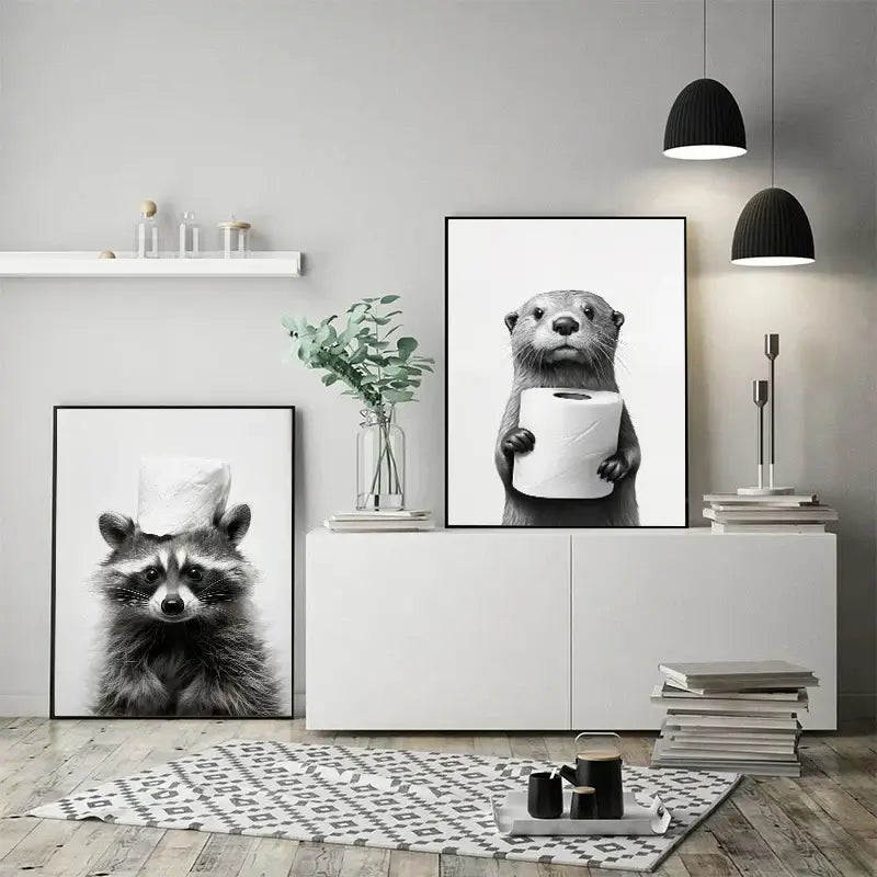 Black-and-white framed decorbites™ bathroom wall art featuring a cute animal canvas of an otter holding toilet paper
