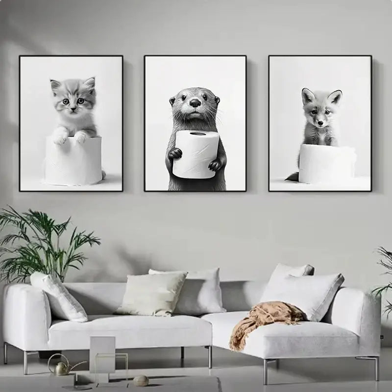 Set of three black-and-white cute animal canvas bathroom wall art prints featuring kitten otter and fox with toilet paper rolls