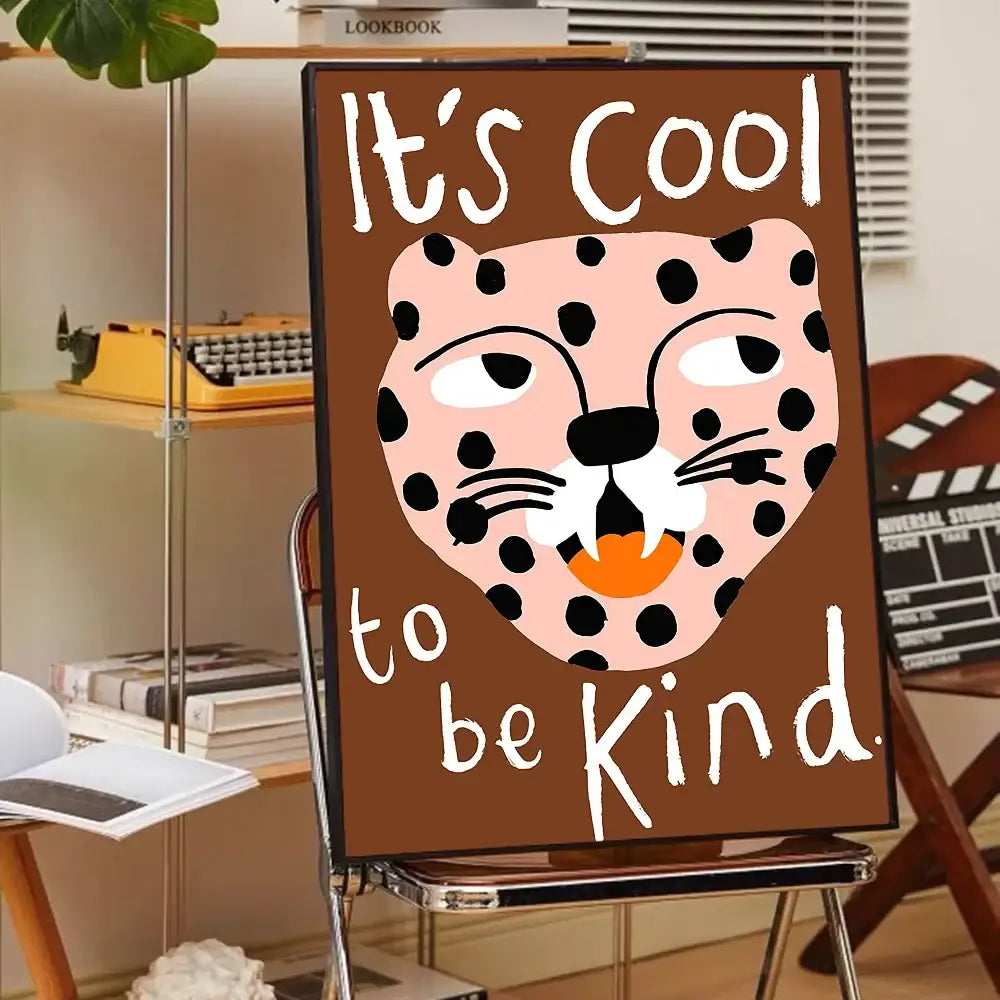 Brown framed canvas art featuring a pink leopard print with its cool to be kind script from decorbites animal print rainbow posters