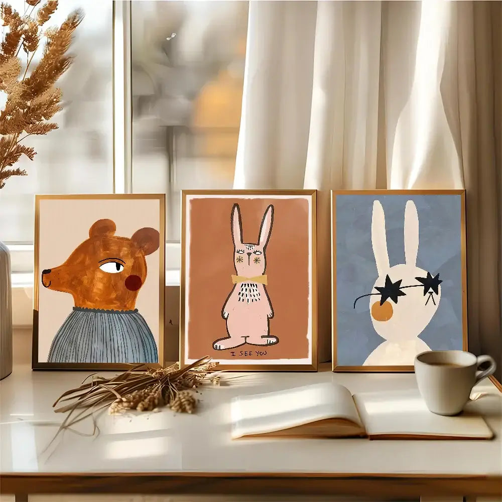 Three framed cartoon animal prints featuring a bear and two rabbits in decorbites™ animal print rainbow movie posters