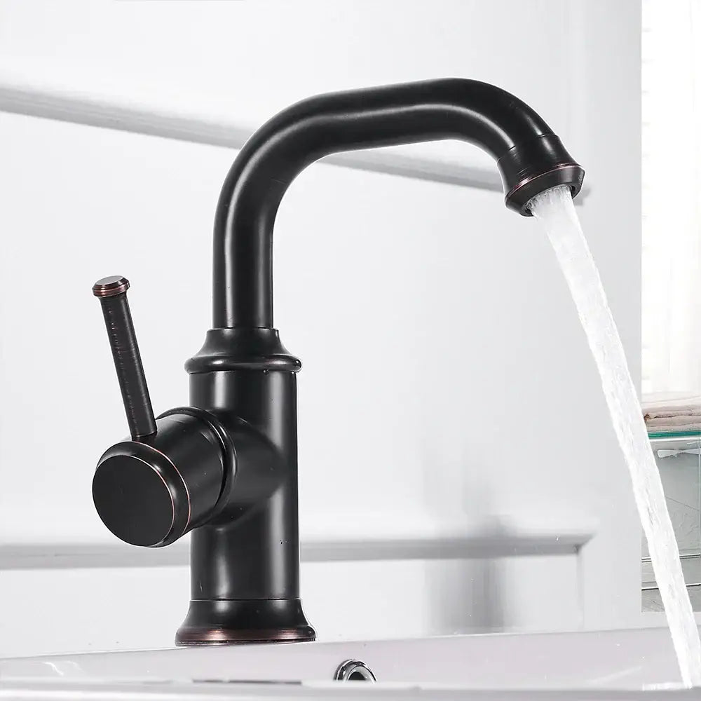 Black brass antique single handle bathroom faucet with curved spout and copper accents for hot cold water mixer by decorbites