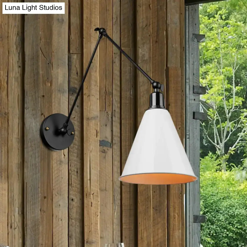 Black wrought iron articulated wall sconce with direct wired design, white conical shade, and orange interior by DecorBites