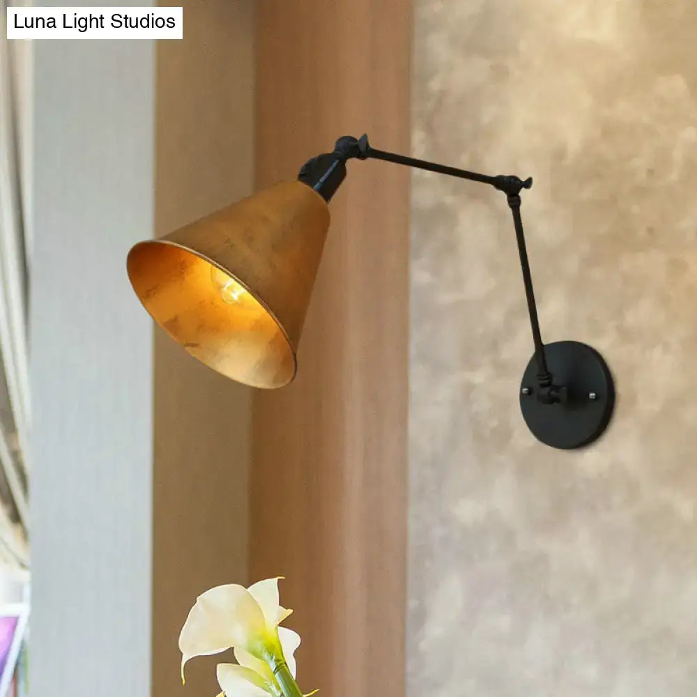 DecorBites™ direct wired wrought iron wall sconce with matte black arm and brass cone shade for ambient lighting
