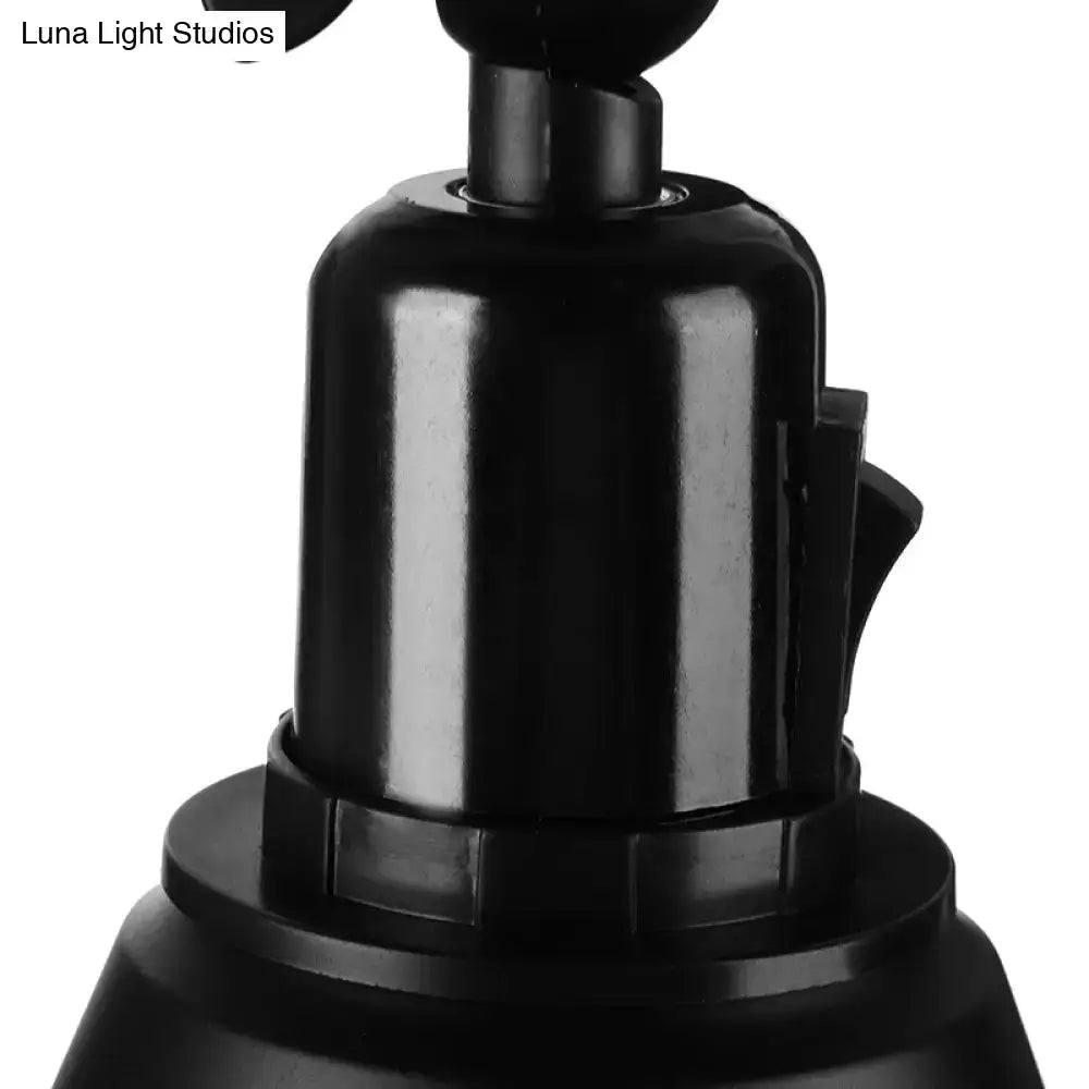 Black plastic camera mount with cylindrical body and textured grip shown with decorbites™ wrought iron direct wired wall sconce