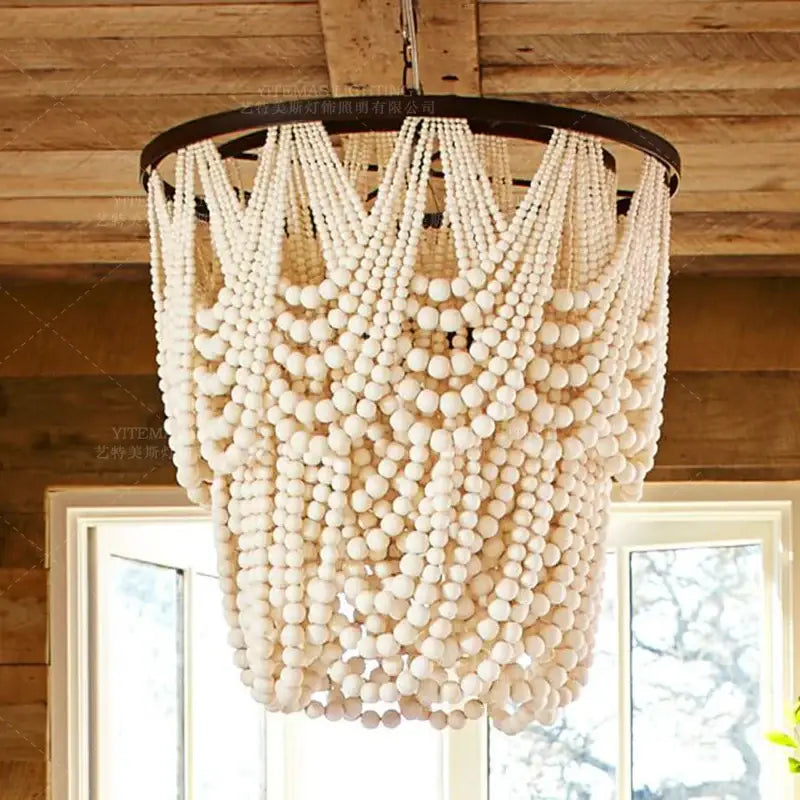 Antique black wood beaded pendant chandelier with off-white wooden beads and dark metal frame for dining room decorbites black wood