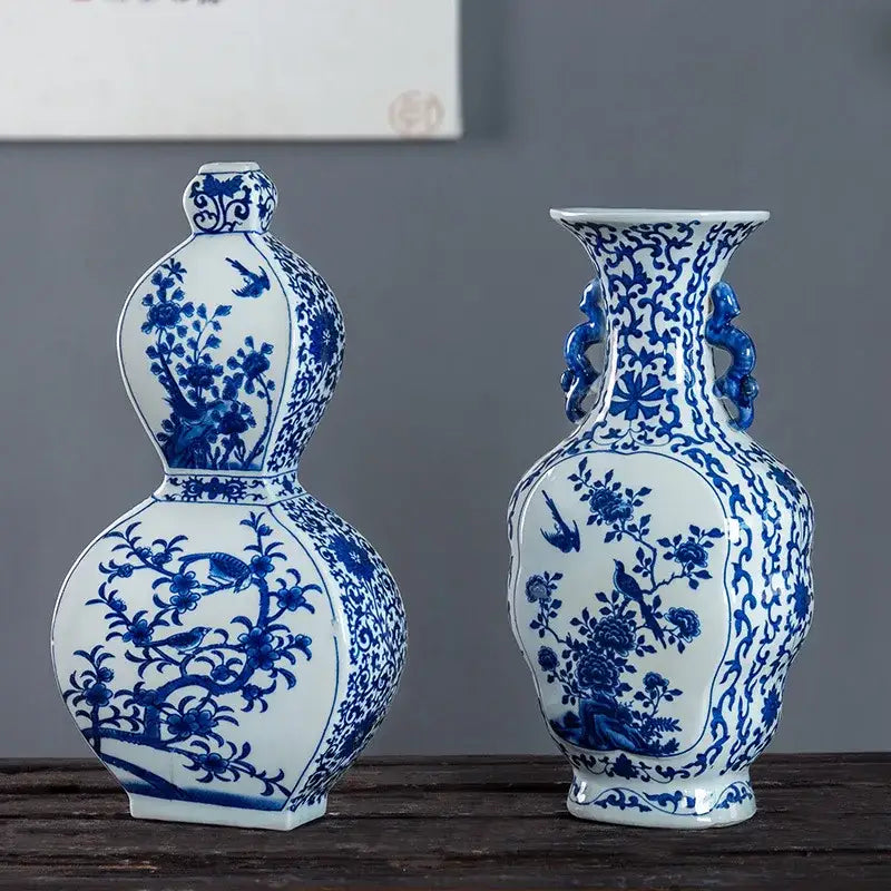 Two elegant blue white porcelain vases with floral bird motifs and two ear dragon handles for living room decor by decorbites
