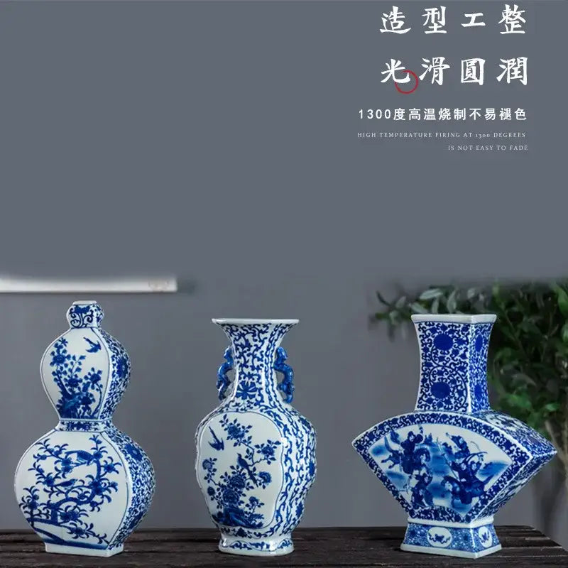 Three blue white porcelain vases including a two ear design with intricate floral and bird patterns for living room decor