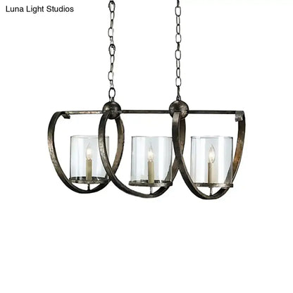 Antique brass and aged silver DecorBites three-bulb dining room chandelier with clear glass candle holders and white taper candles