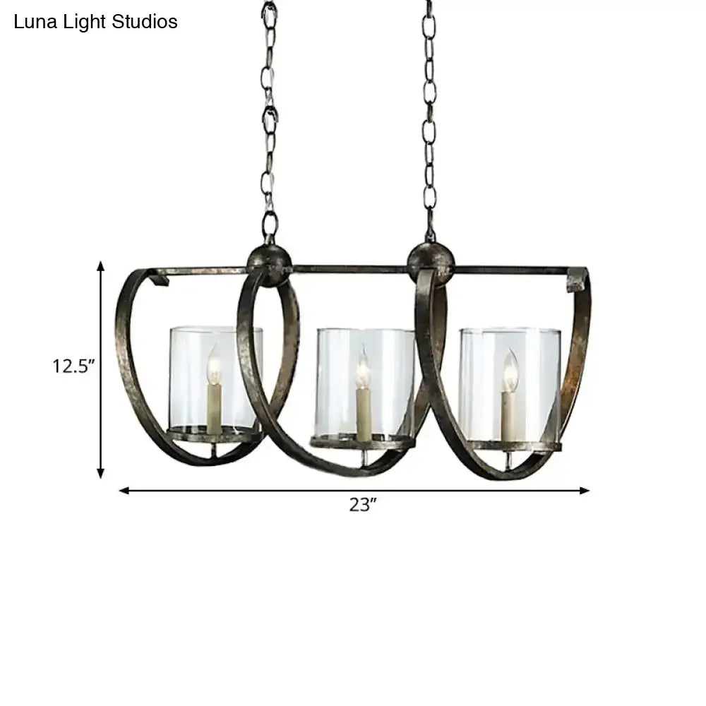 Wrought iron chandelier with three clear glass candle holders and rustic finish in antique brass and aged silver for dining room
