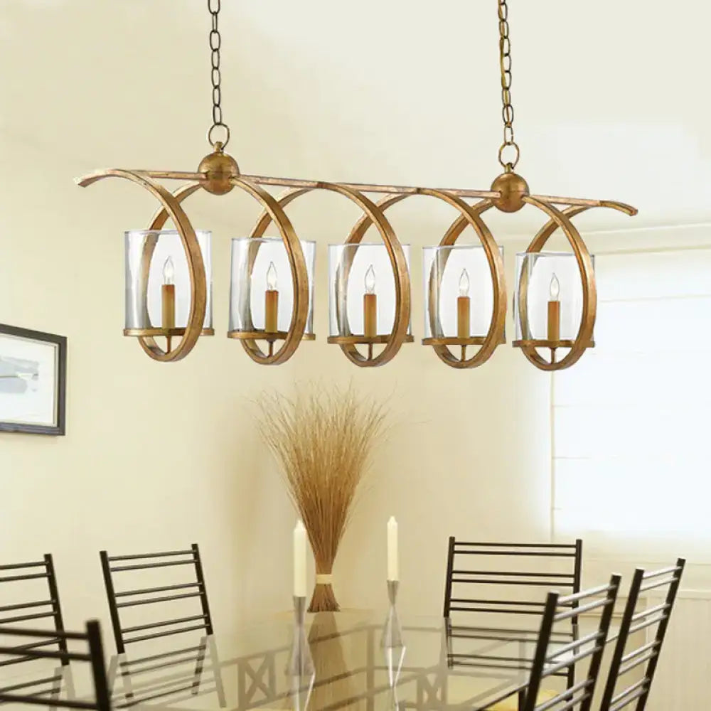 Decorbites traditional five-bulb dining room chandelier with antique brass finish and clear glass candle holders