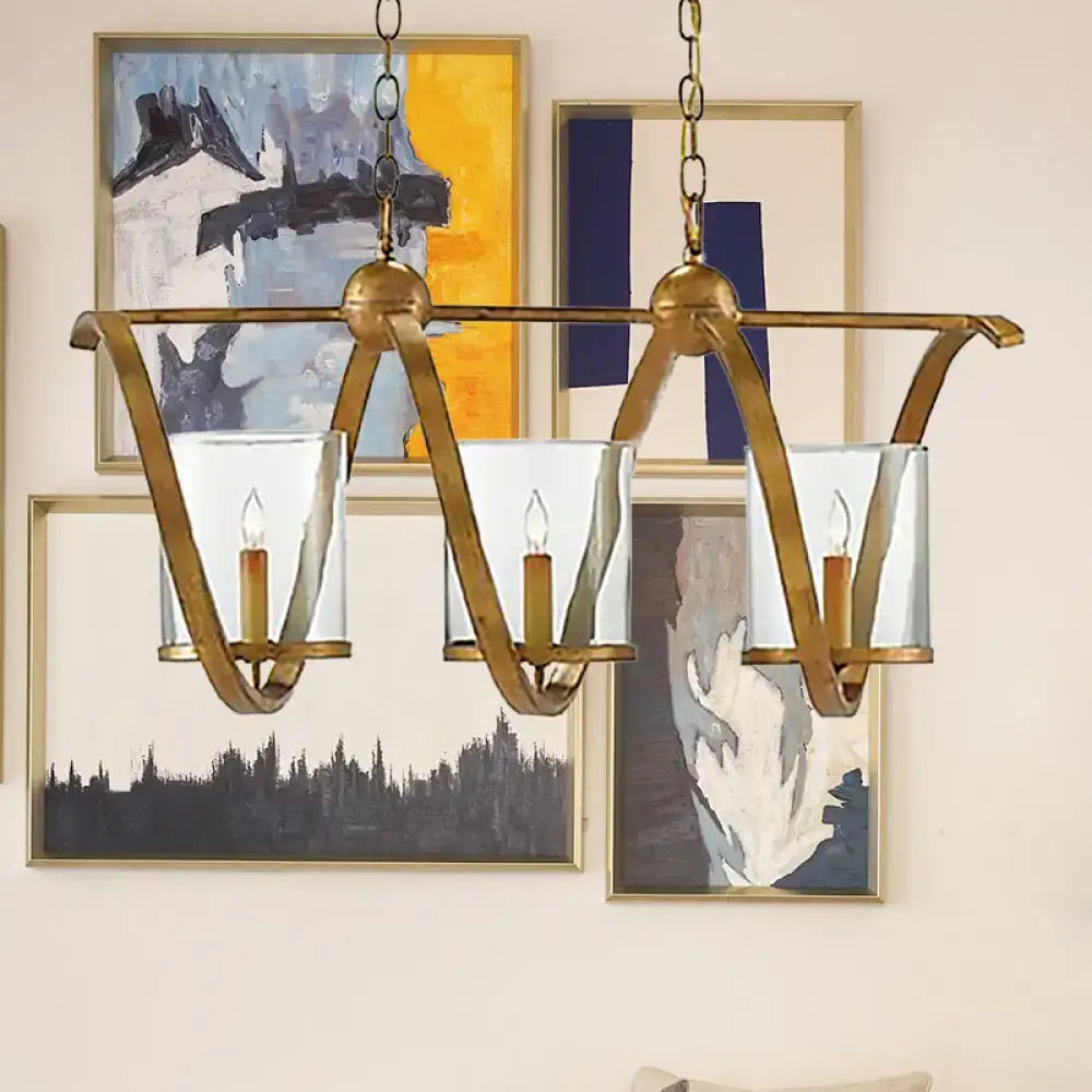 Decorbites traditional dining room chandelier with antique brass finish, clear glass shades, and aged silver accents