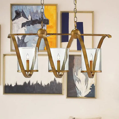 Decorbites traditional dining room chandelier with antique brass finish, clear glass shades, and aged silver accents
