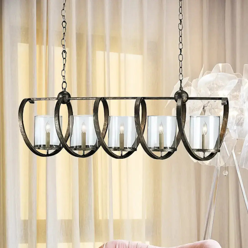 Wrought iron chandelier with five clear glass candle holders and rustic finish in antique brass and aged silver for dining room