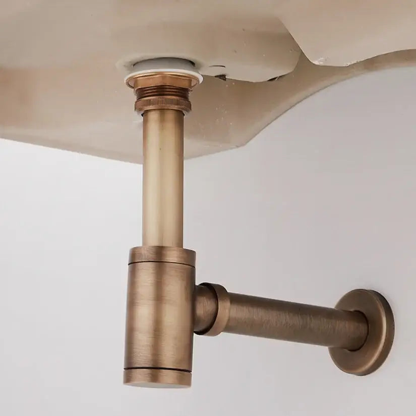 Antique brass air isolation drain pipe with vintage finish and threaded connections for bathroom sink installation