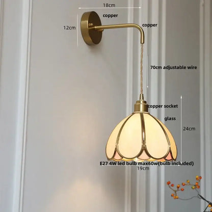 Antique brass wall light with a vintage copper sconce and decorbites amber glass led petal-shaped shade