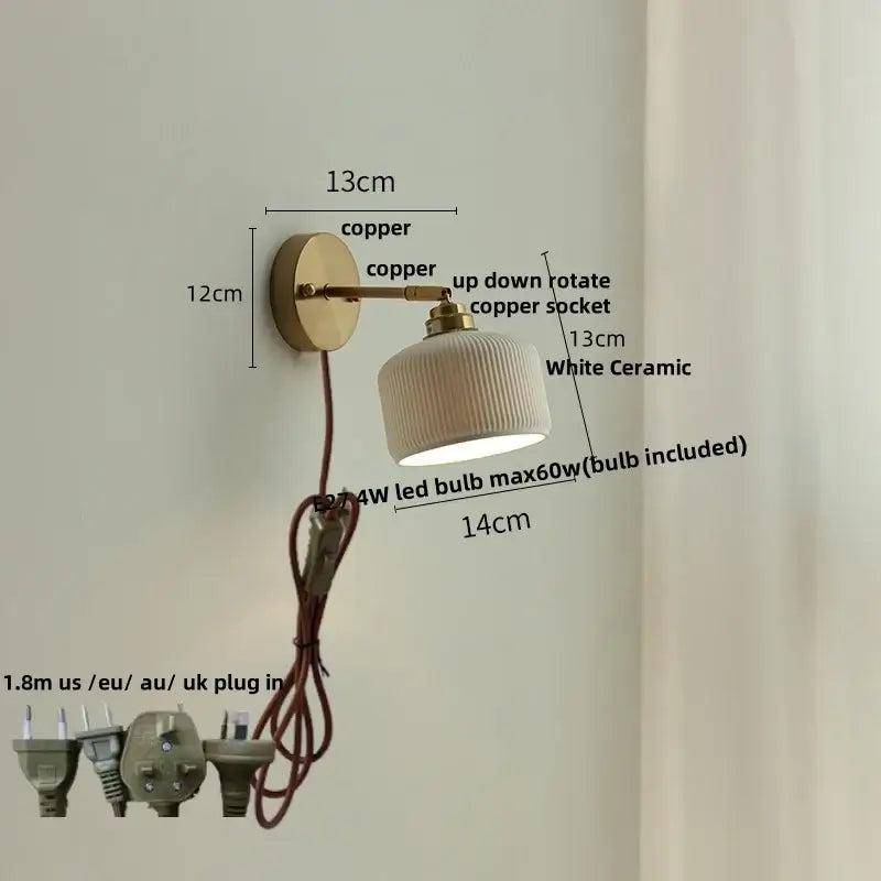 A sleek white ceramic led wall light with ribbed texture mounted on a polished antique brass and copper arm decorbites ceramic led