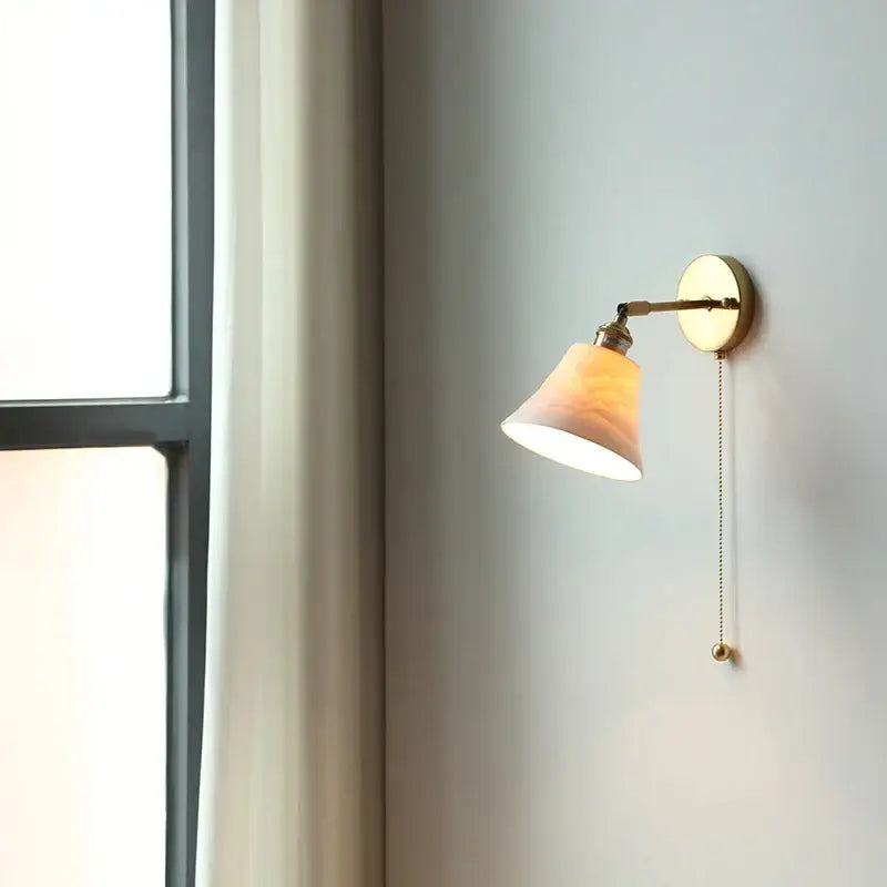 Antique brass and amber glass adjustable wall light with translucent shade for decorbites ceramic led wall decor