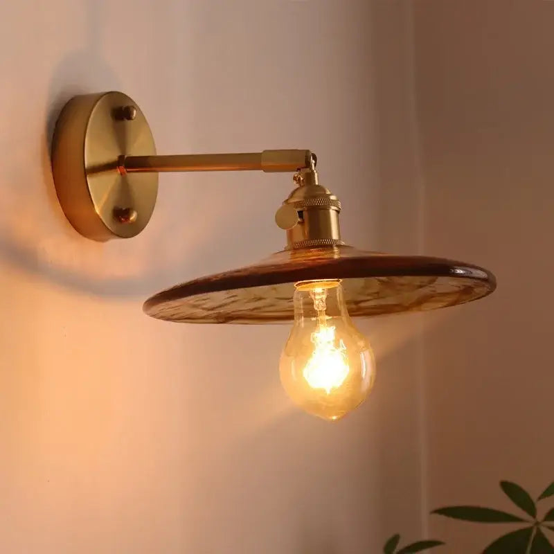 Antique brass wall lights with amber glass copper led shade and exposed filament bulb for bedroom lighting