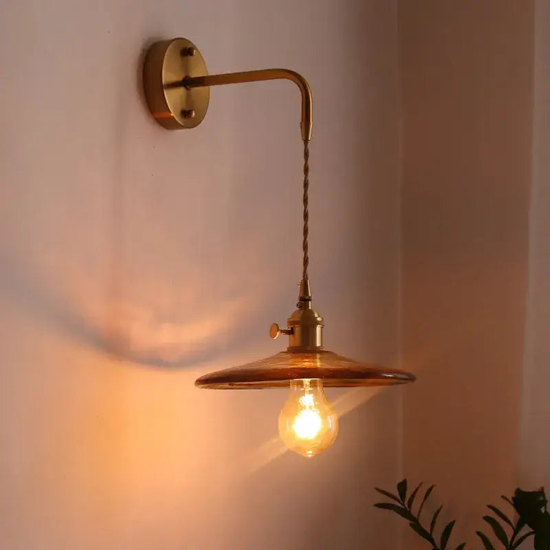 Antique brass wall lights with twisted cord and amber glass copper led shade ideal for bedroom lighting