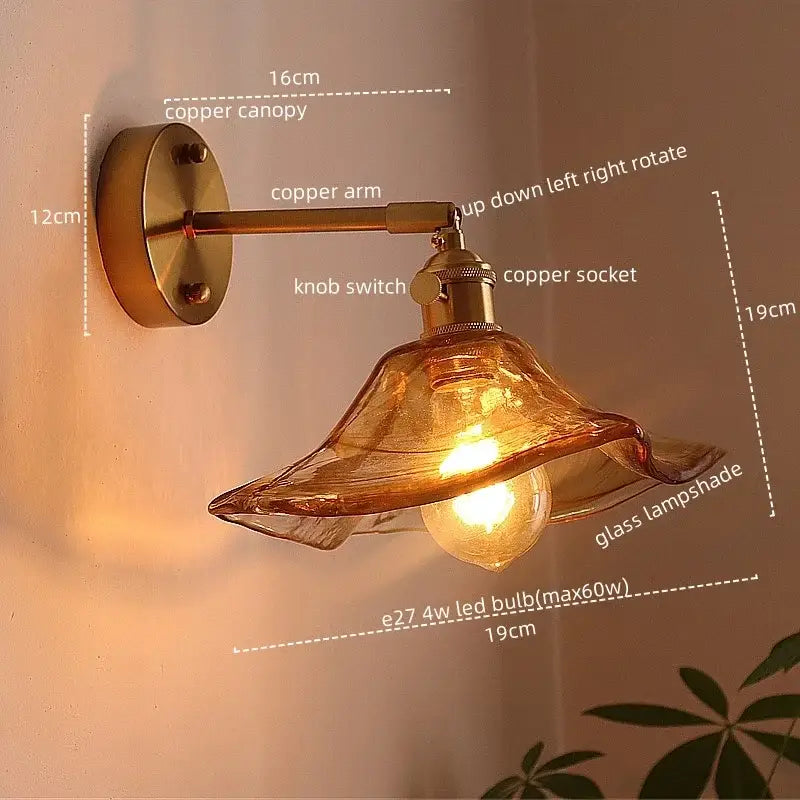 Antique brass and amber glass copper led wall light with warm amber lampshade and exposed bulb for bedroom use