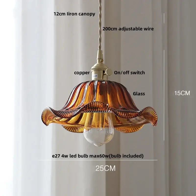 Antique brass and amber glass led hanging pendant light featuring hand-blown amber glass with a fluted petal design