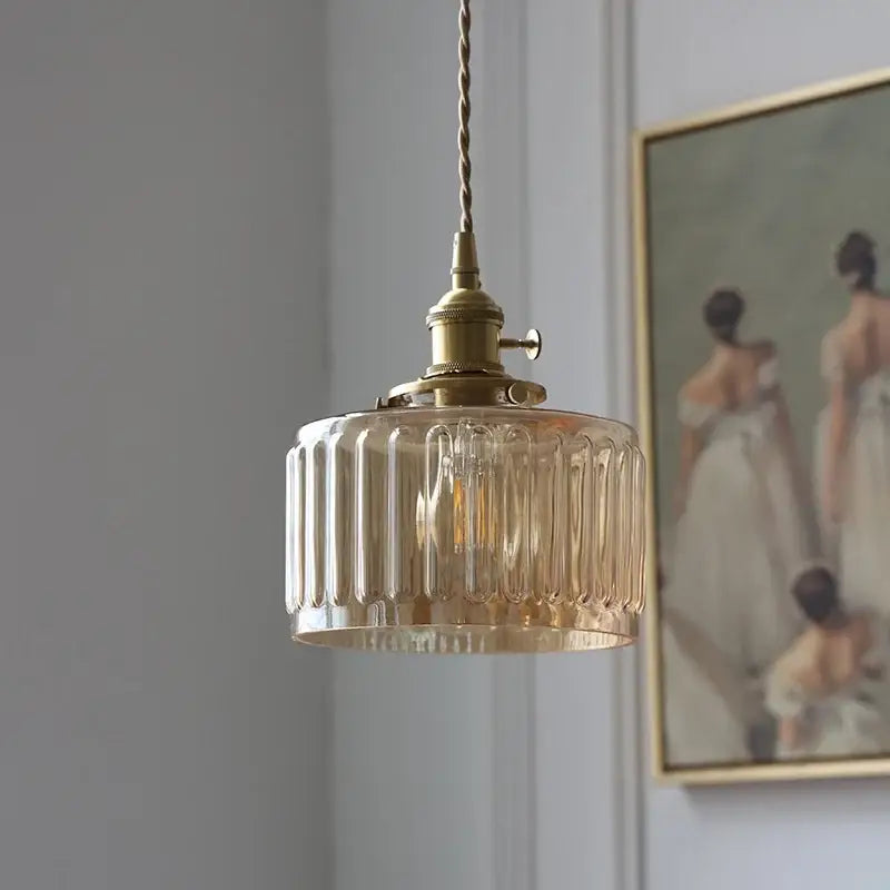 Antique brass pendant light with amber glass led vertical ridges in metal fixture ideal for stair pendant lighting