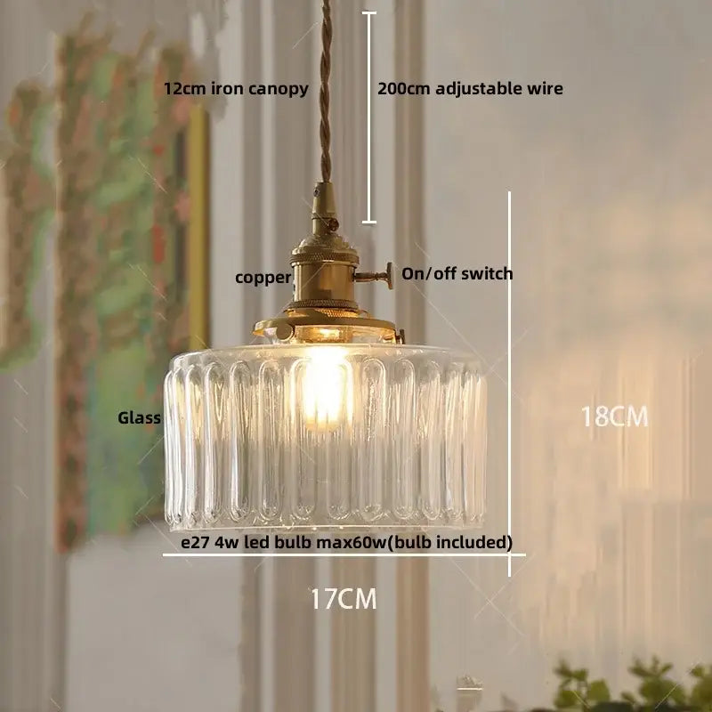 Antique brass and amber glass led pendant light with clear glass vertical ridges and brass copper-finished canopy hanging on adjustable wire
