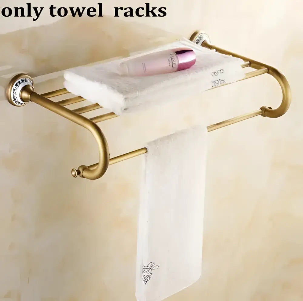 Gold-toned metal towel rack with decorative blue and white ceramic end caps in decorbites bathroom accessories set