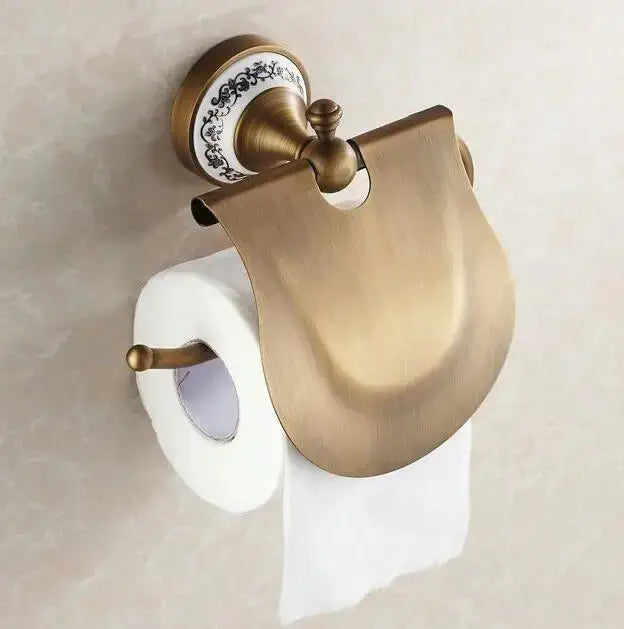 Antique brass and ceramic toilet paper holder with curved metal cover from decorbites bathroom accessories set