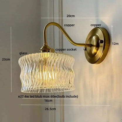 Antique brass wall sconce with clear glass wavy shade for bedroom light featuring decorbites clear glass design