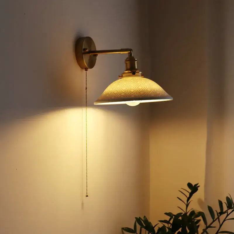 Warm-toned antique brass wall lamp with textured off-white ribbed glass shade and pull chain switch for bedroom decorbites ceramic copper led